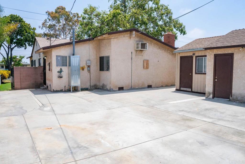 15523 Studebaker Road Norwalk, CA 90650 - Photo 10 of 59 a view of a house with a yard