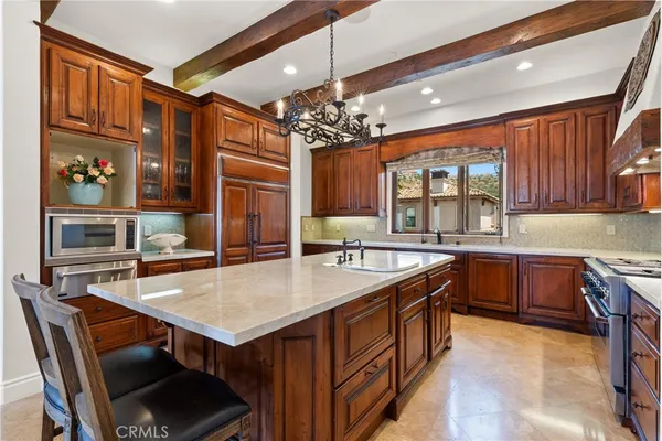 a kitchen with counter top space and breakfast area