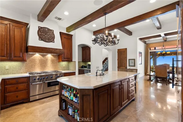 a kitchen with stainless steel appliances granite countertop a stove and a sink