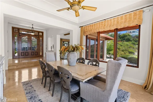 a bathroom with a granite countertop sink a mirror and a shower