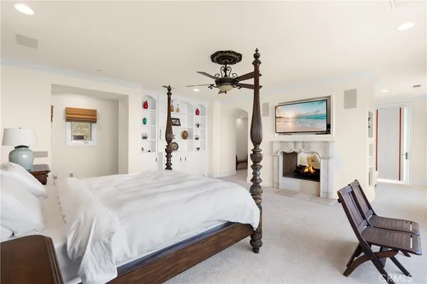 a bedroom with two beds and a large mirror