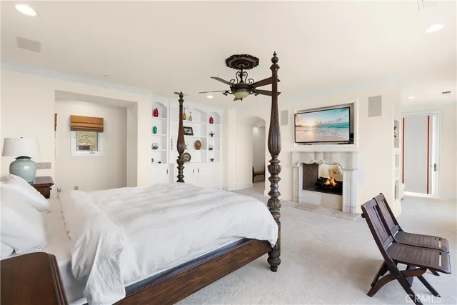 a bedroom with two beds and a large mirror