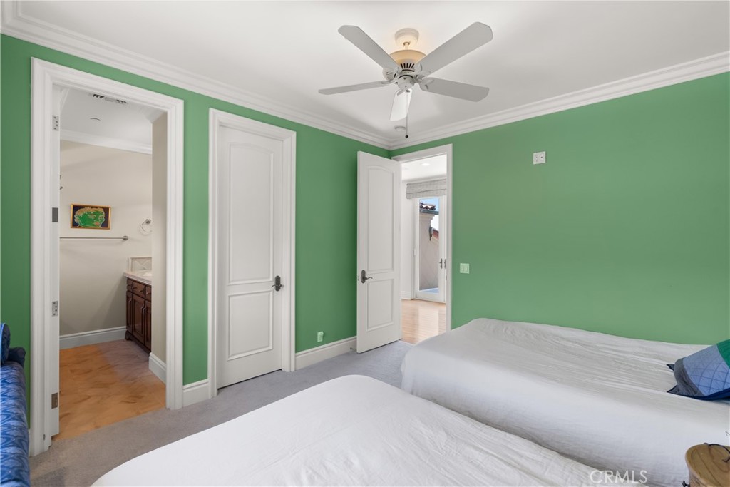 4 Le Conte Laguna Niguel, CA 92677 - Photo 35 of 65 a bedroom with a large bed and a chandelier