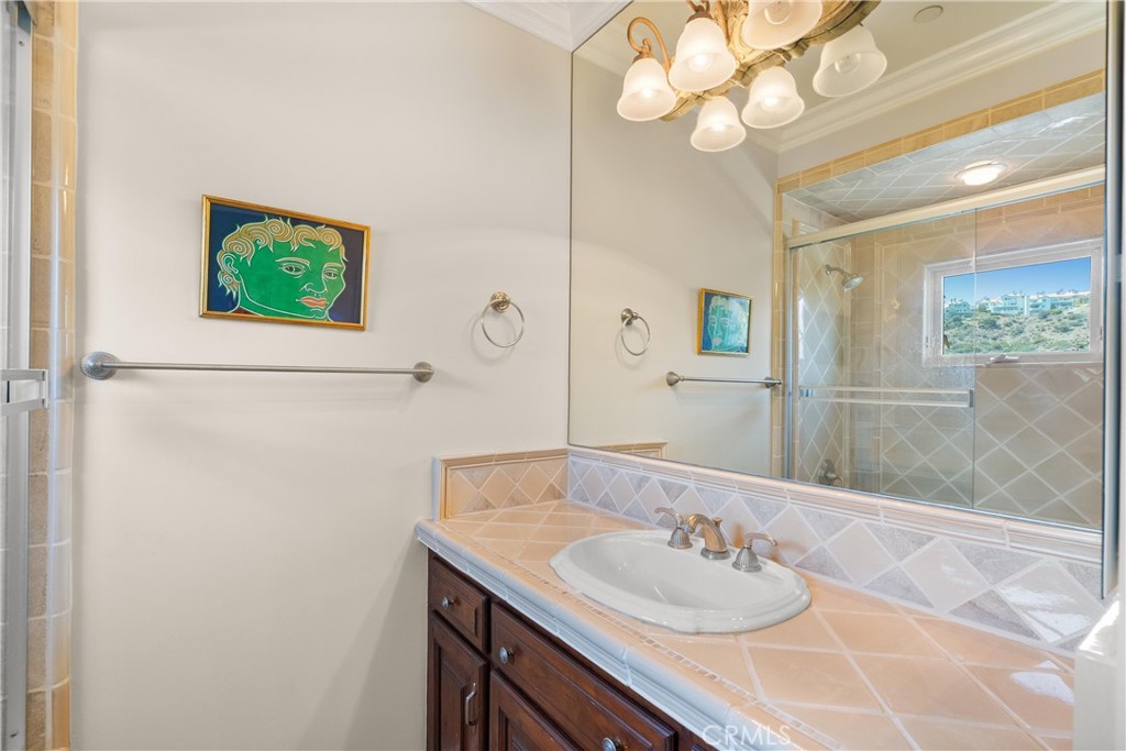 4 Le Conte Laguna Niguel, CA 92677 - Photo 36 of 65 a bathroom with a sink and a mirror