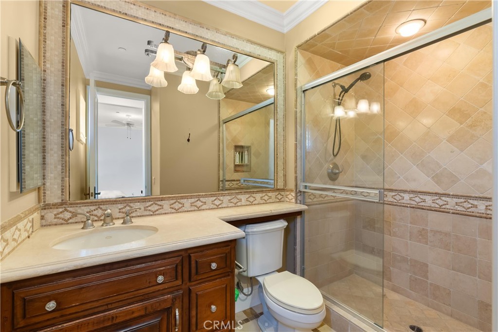4 Le Conte Laguna Niguel, CA 92677 - Photo 39 of 65 a bathroom with a sink a toilet and a mirror