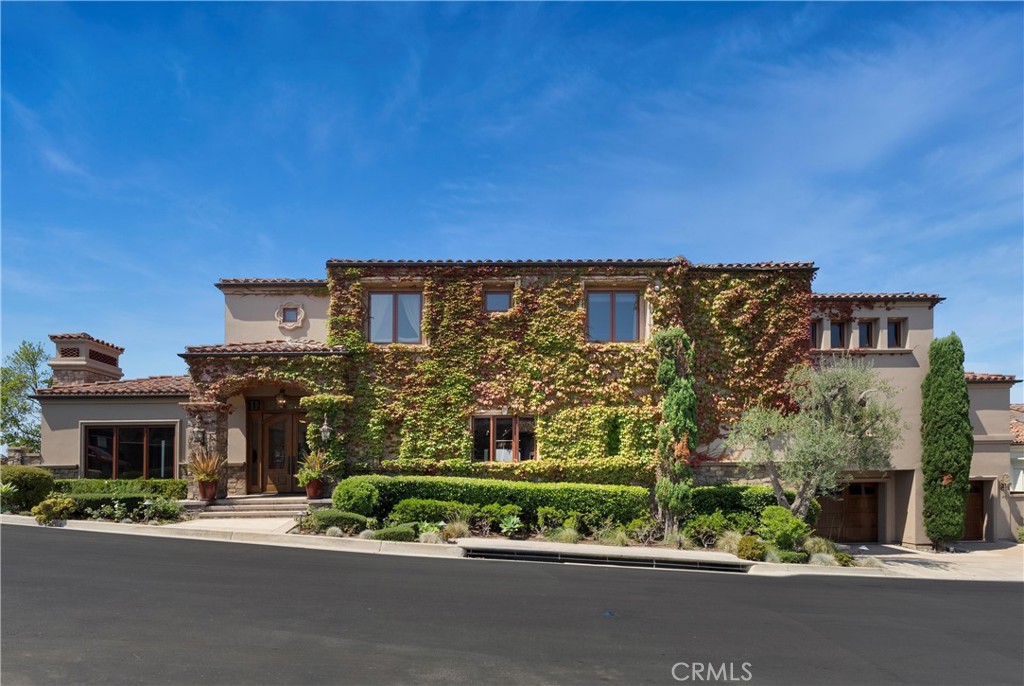 4 Le Conte Laguna Niguel, CA 92677 - Photo 4 of 65 a front view of a building with a garden and plants