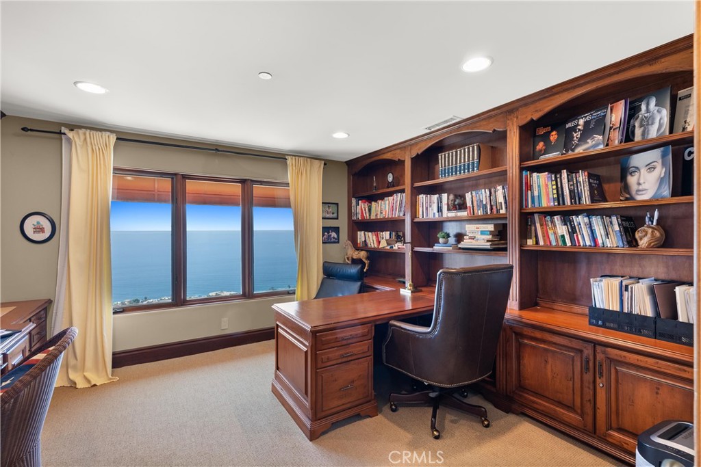4 Le Conte Laguna Niguel, CA 92677 - Photo 45 of 65 a work room with furniture and a book shelf