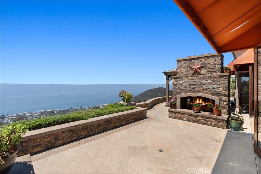 4 Le Conte Laguna Niguel, CA 92677 - Photo 48 of 65 a view of a balcony with two chairs and a fireplace