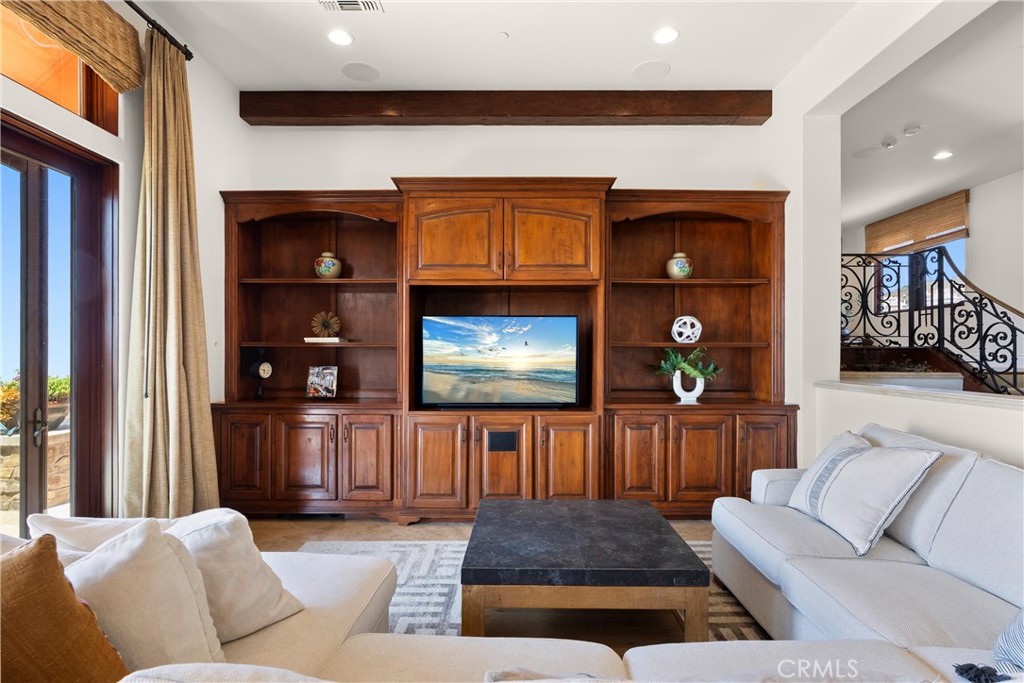 4 Le Conte Laguna Niguel, CA 92677 - Photo 8 of 65 a living room with furniture a fireplace and a flat screen tv