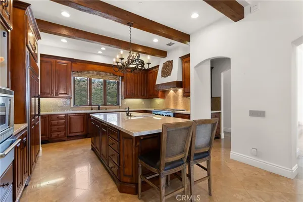 a kitchen with a stove and a refrigerator