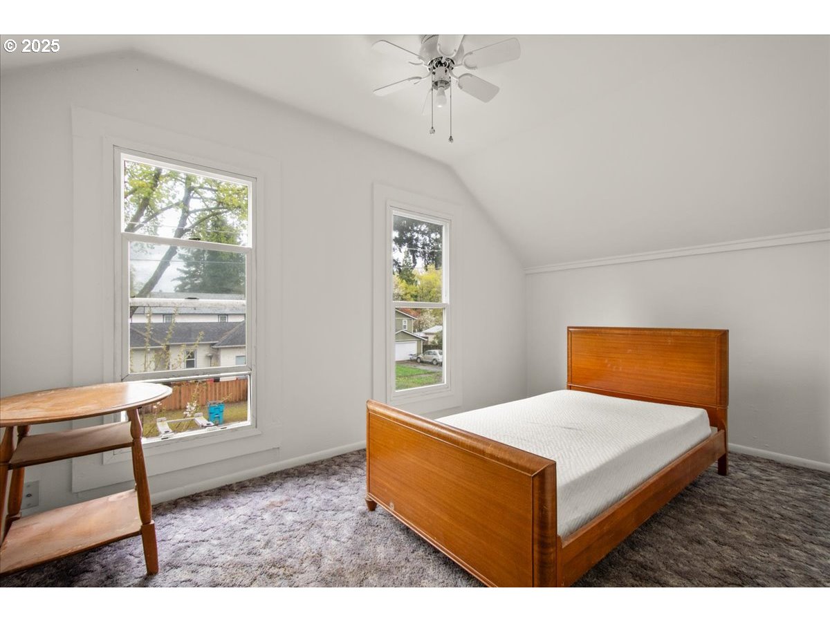 514 North Main Avenue Ridgefield, WA 98642 - Photo 11 of 16 a living room with a bed furniture and a window