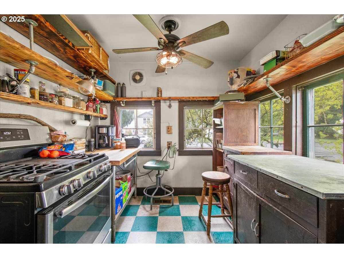 514 North Main Avenue Ridgefield, WA 98642 - Photo 8 of 16 a kitchen with stainless steel appliances a stove a sink and cabinets