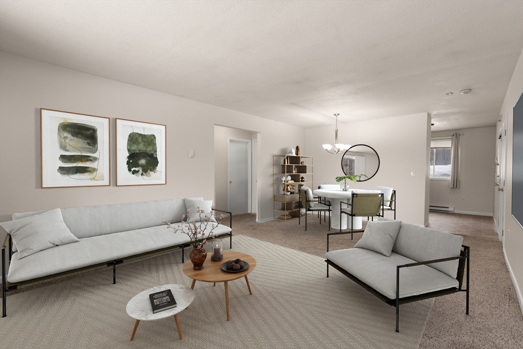 121 Bailey Street, Unit D31 Worcester, MA 01602 - Photo 2 of 25 a living room with furniture a rug and a large window