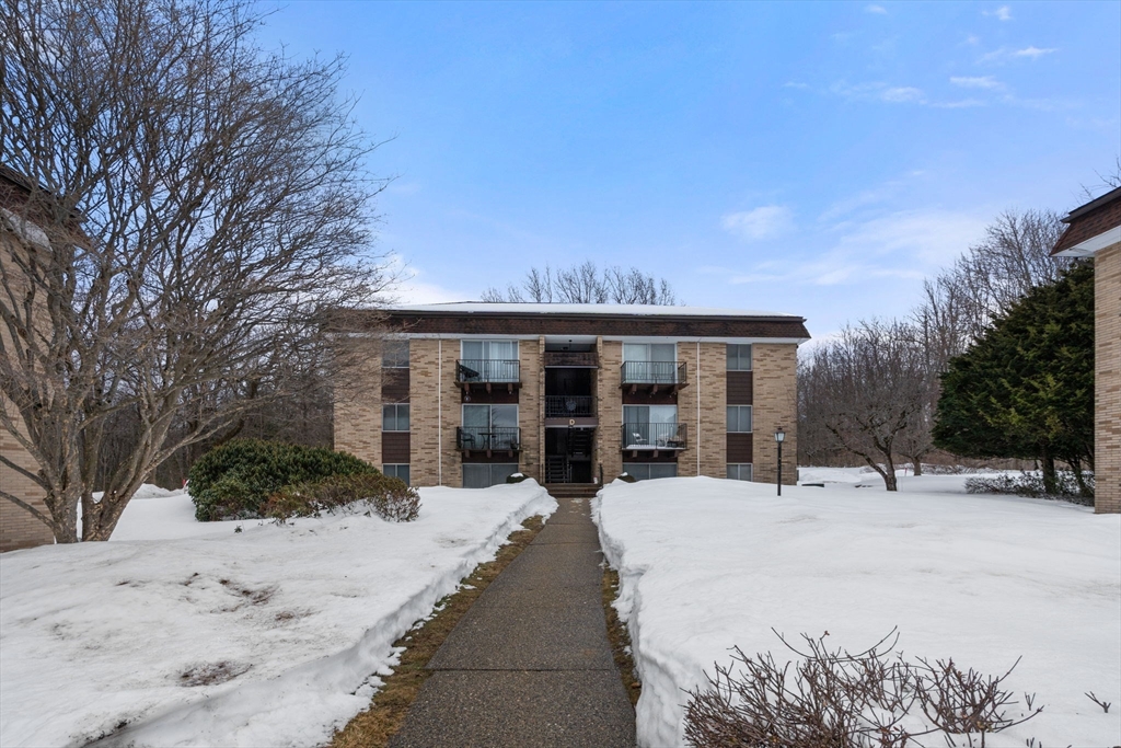 121 Bailey Street, Unit D31 Worcester, MA 01602 - Photo 22 of 25 a view of a house with a snow in the yard