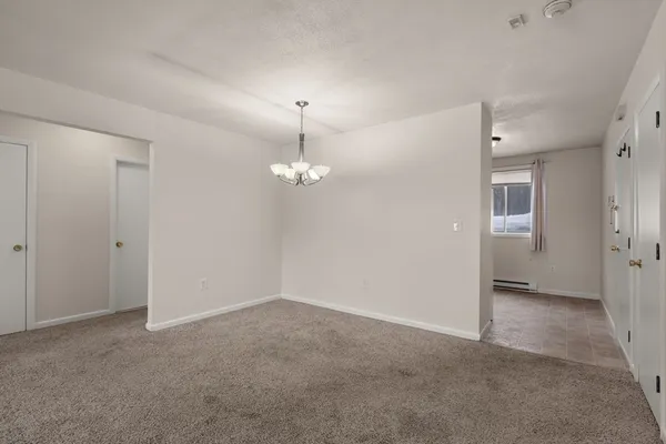 an empty room with a view of a bathroom