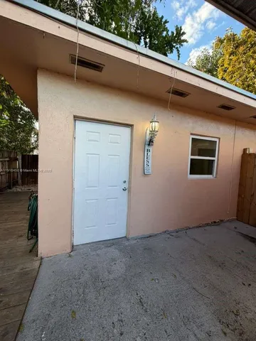 a view of a door and a window