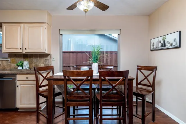 a bedroom with a bed and a flat tv screen on dresser
