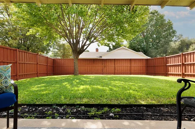 a view of a backyard with a garden