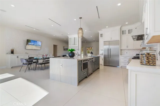 a view of walk in closet with wooden floor and a window