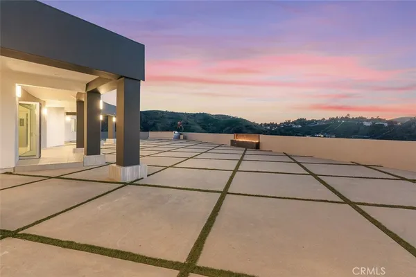 a view of a terrace with a yard