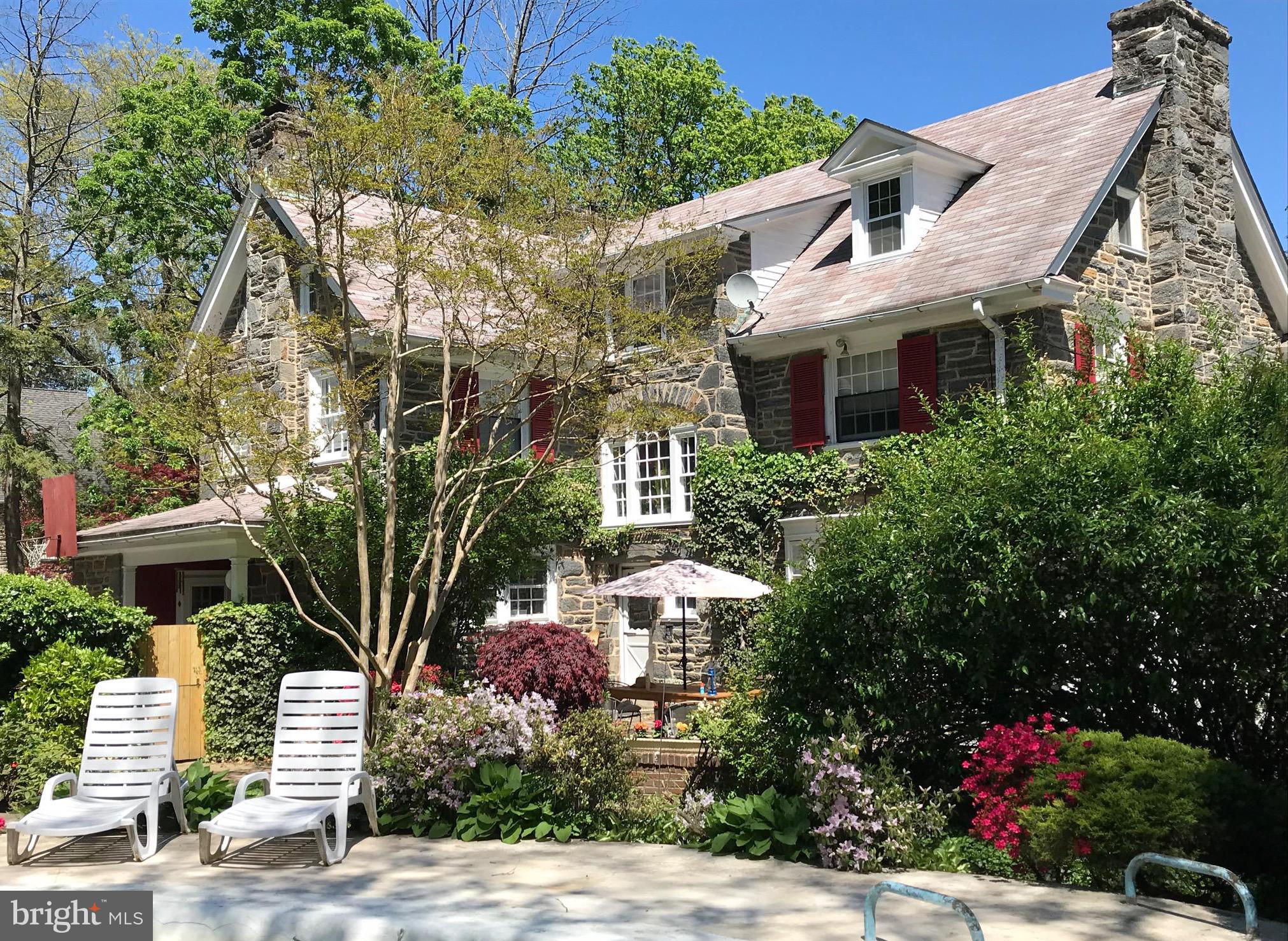 402 Penn Road Wynnewood, PA 19096 - Photo 19 of 75 a front view of a house with a garden