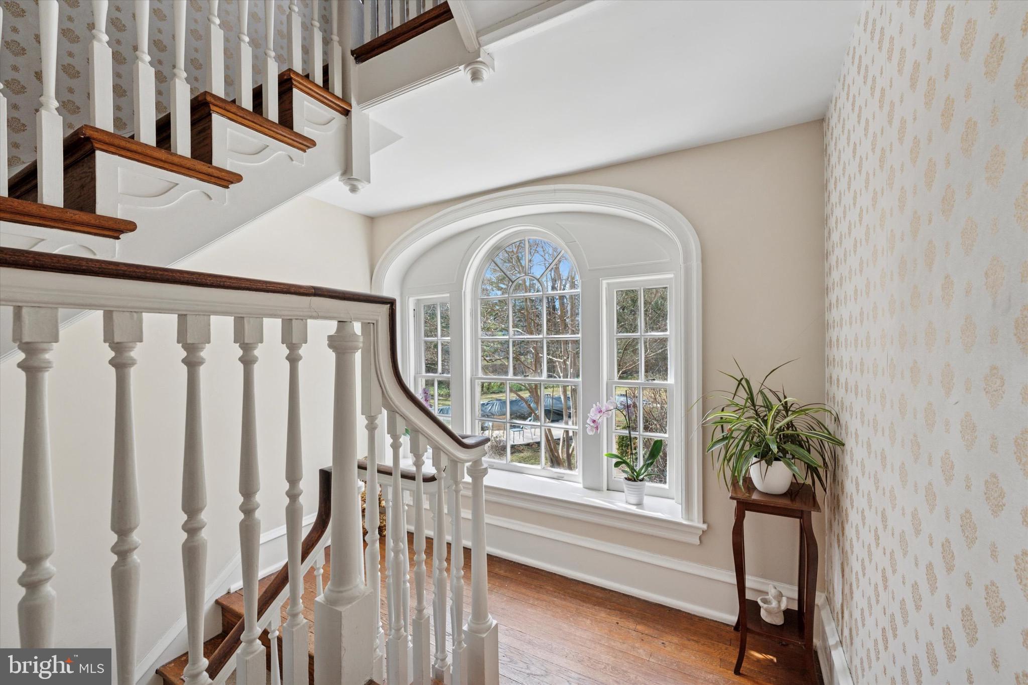 402 Penn Road Wynnewood, PA 19096 - Photo 24 of 75 a view of staircase with wooden floor and a potted plant