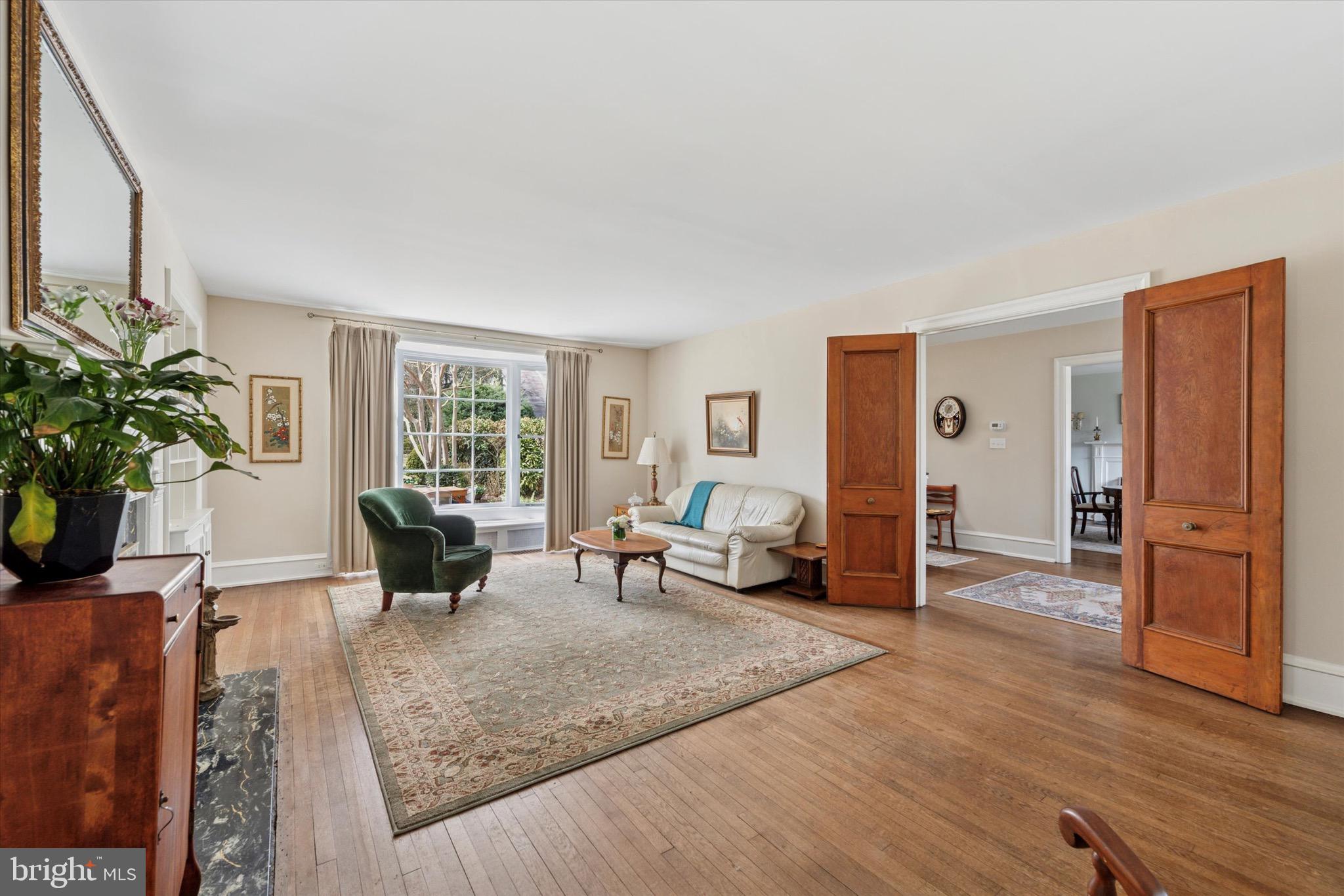 402 Penn Road Wynnewood, PA 19096 - Photo 27 of 75 a living room with furniture and large windows