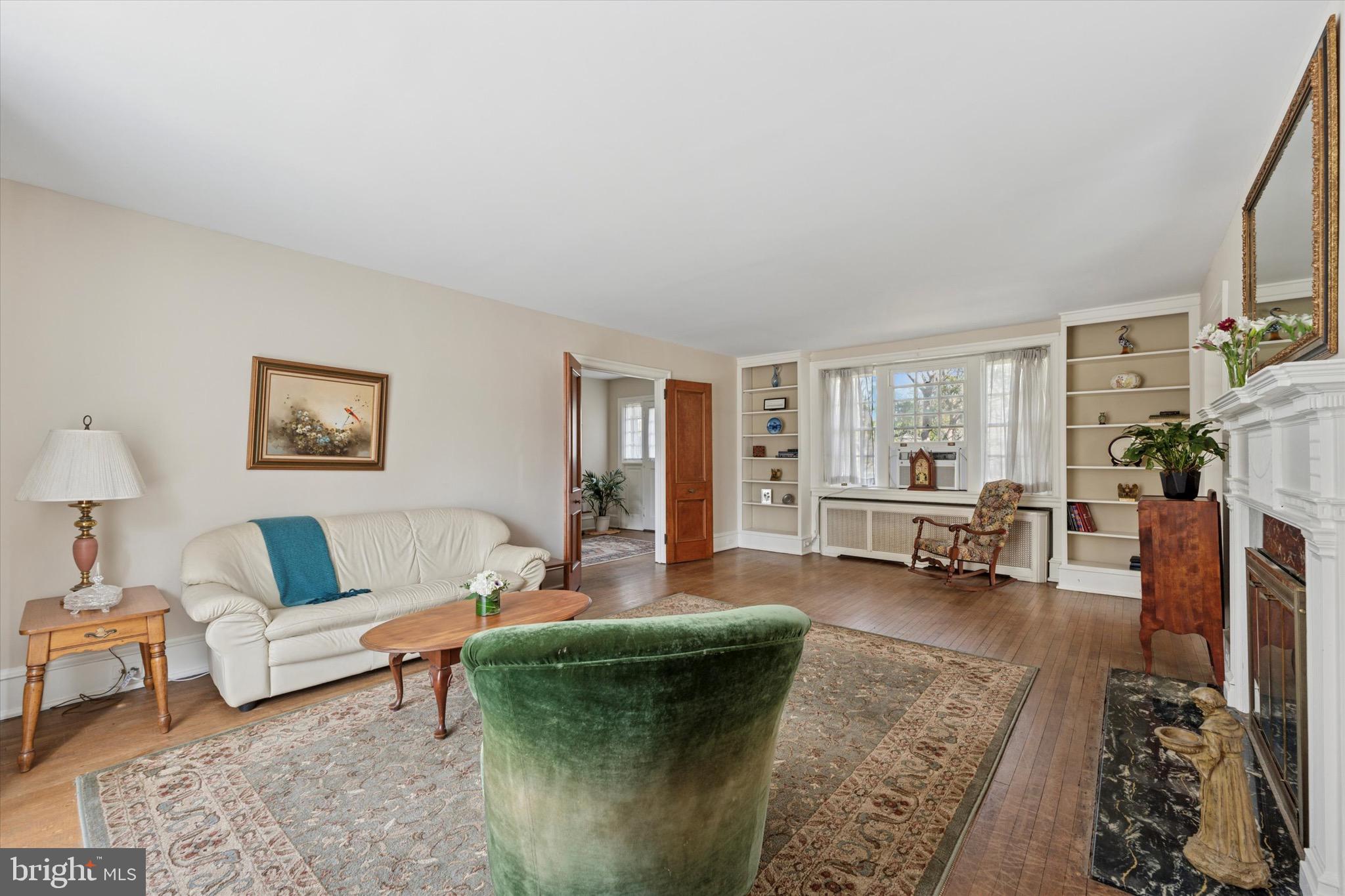 402 Penn Road Wynnewood, PA 19096 - Photo 29 of 75 a living room with furniture and a fireplace