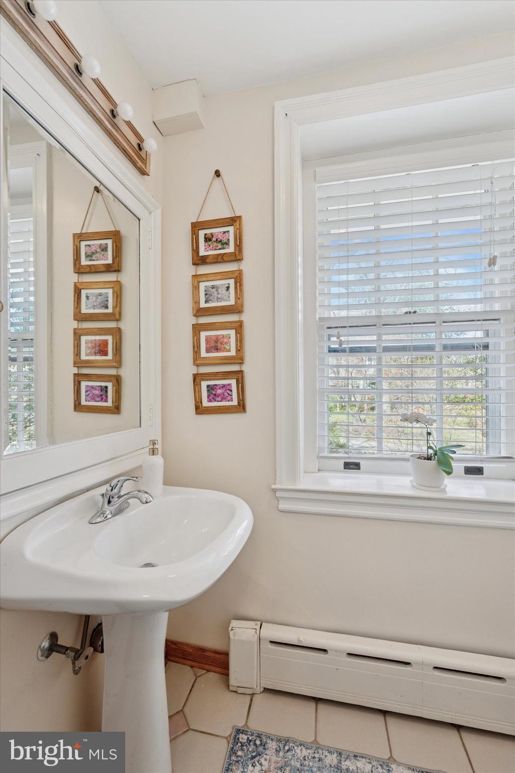 402 Penn Road Wynnewood, PA 19096 - Photo 43 of 75 a bathroom with a sink and a window