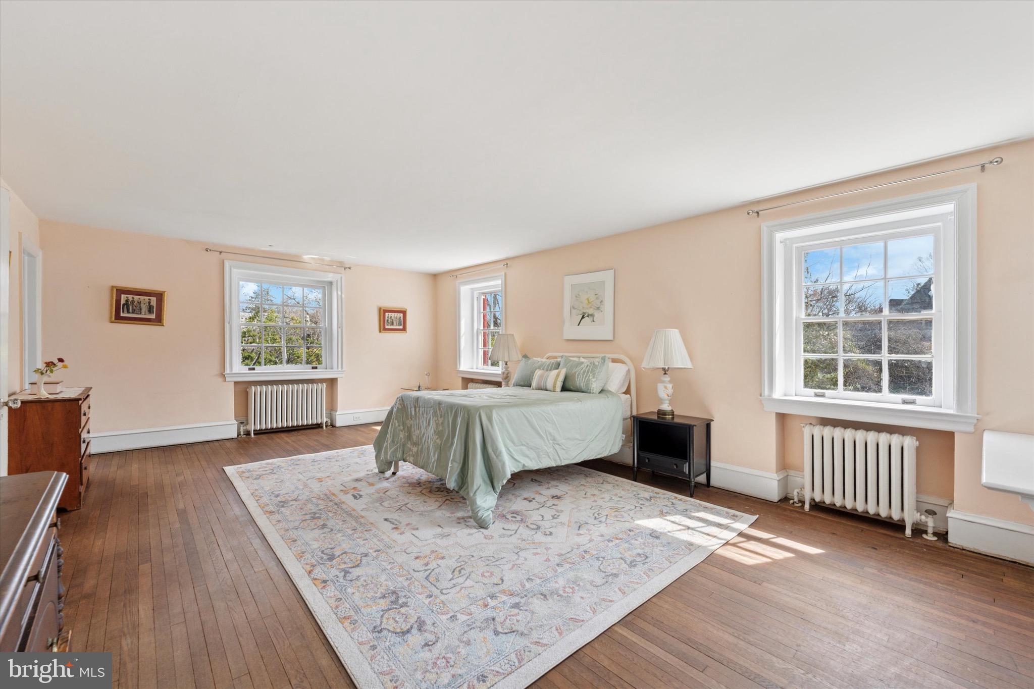 402 Penn Road Wynnewood, PA 19096 - Photo 44 of 75 a bedroom with a bed and wooden floor