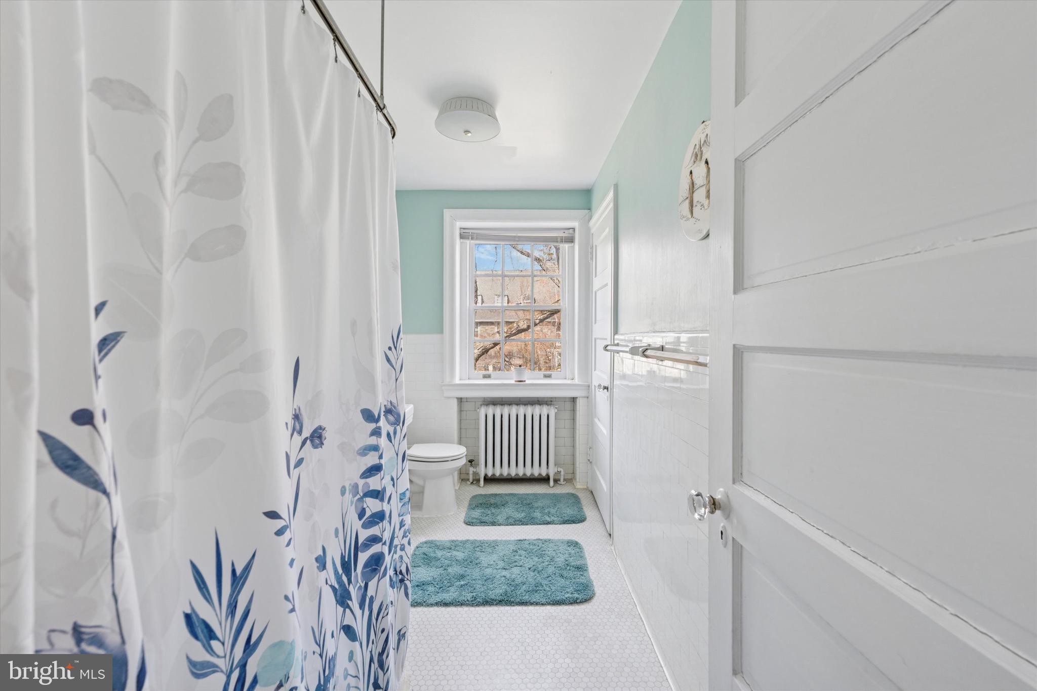 402 Penn Road Wynnewood, PA 19096 - Photo 48 of 75 a room with a window and a white door
