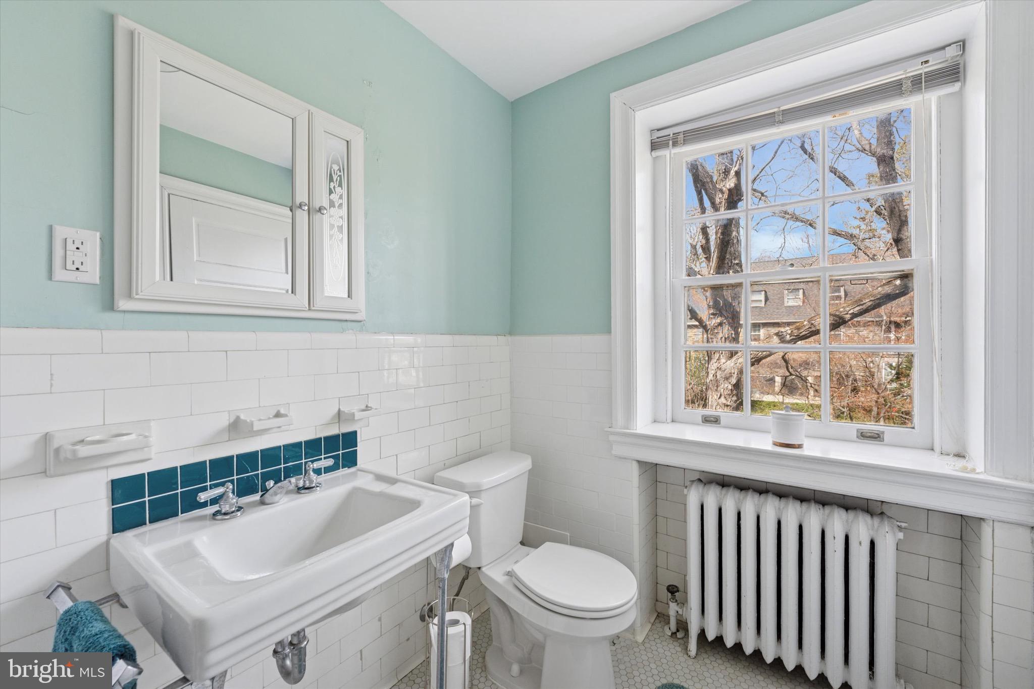 402 Penn Road Wynnewood, PA 19096 - Photo 49 of 75 a bathroom with a sink a toilet and a window