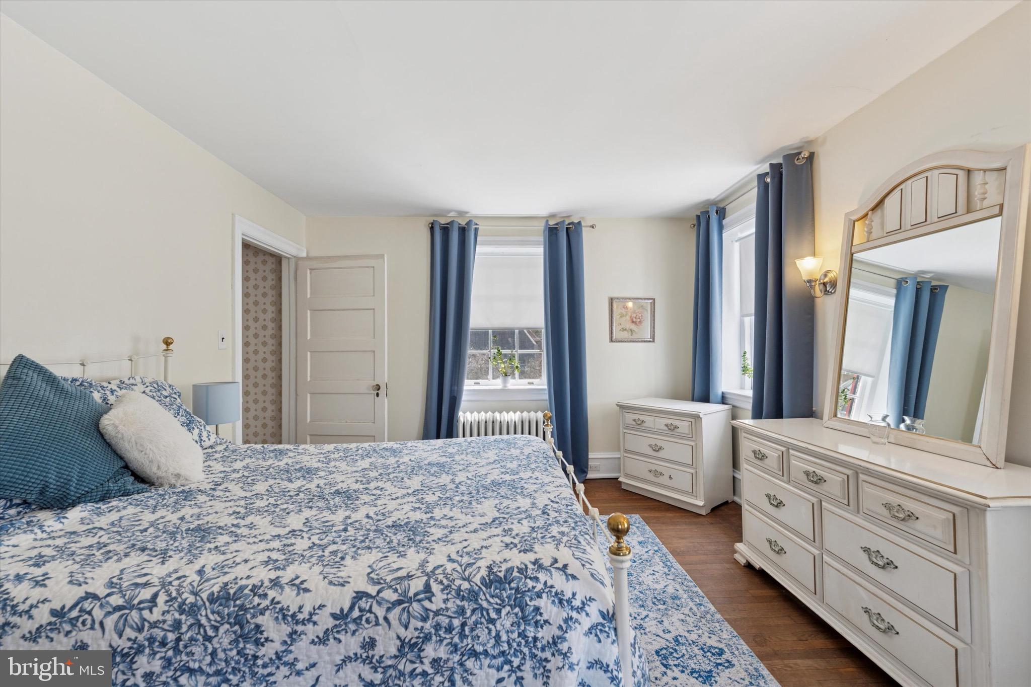402 Penn Road Wynnewood, PA 19096 - Photo 51 of 75 a spacious bedroom with a large bed and a dresser