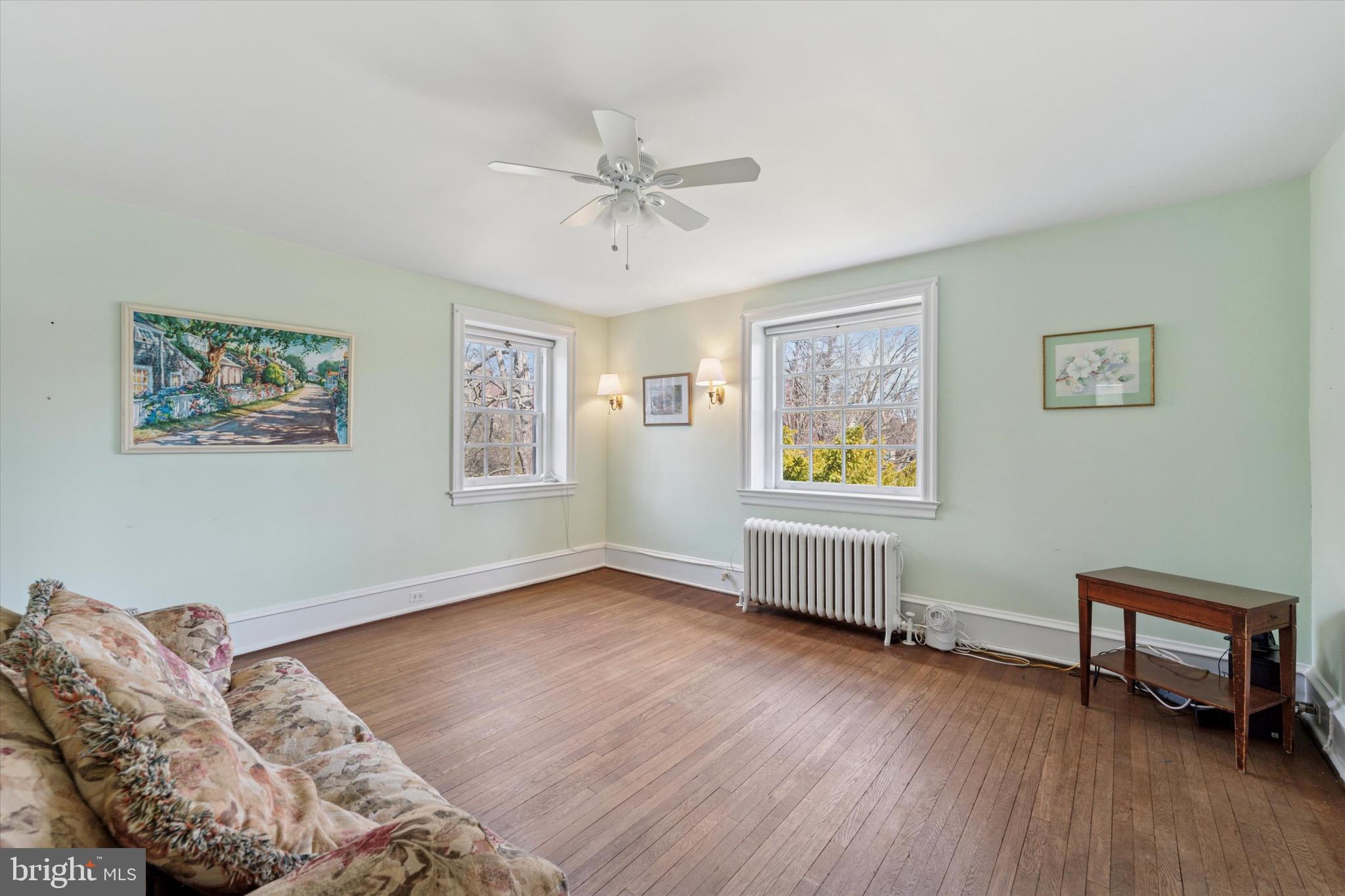 402 Penn Road Wynnewood, PA 19096 - Photo 52 of 75 a bedroom with furniture wooden floor and window