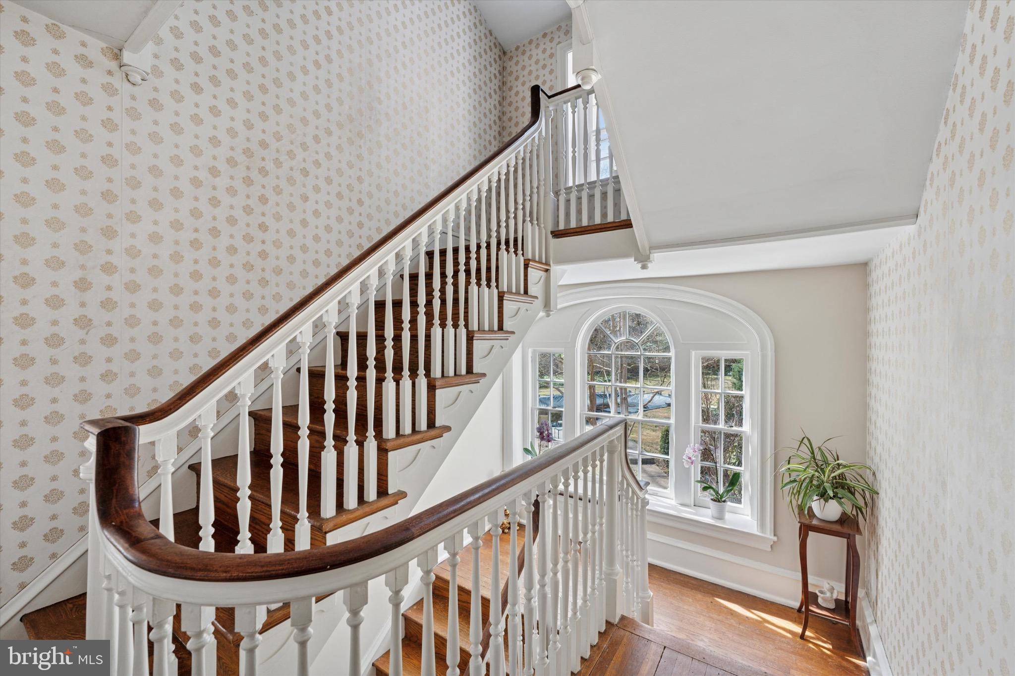 402 Penn Road Wynnewood, PA 19096 - Photo 54 of 75 a view of staircase with wooden floor and a large window