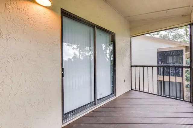 a view of a house with wooden floor and a window