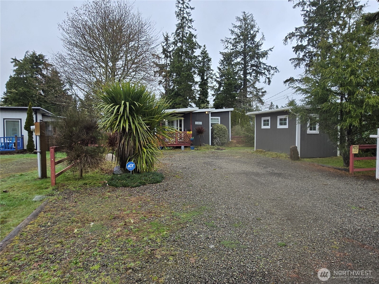 2205 300th Place Ocean Park, WA 98640 - Photo 1 of 20 a view of a house with a yard and potted plants