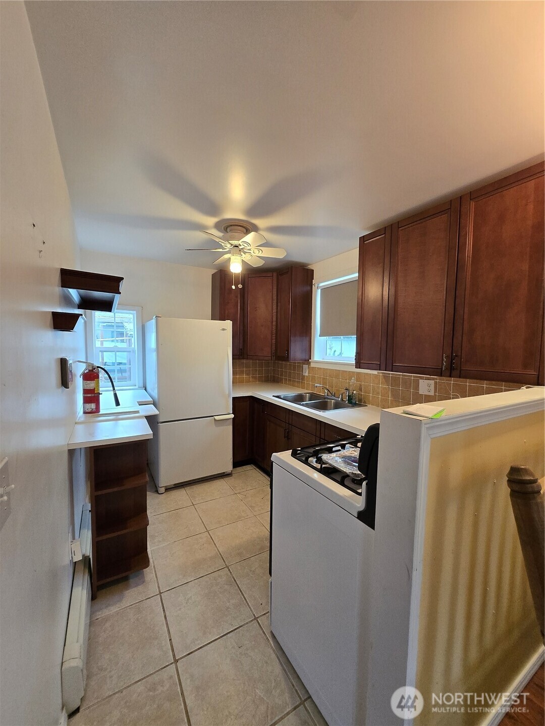 2205 300th Place Ocean Park, WA 98640 - Photo 16 of 20 a kitchen with kitchen island cabinets and oven