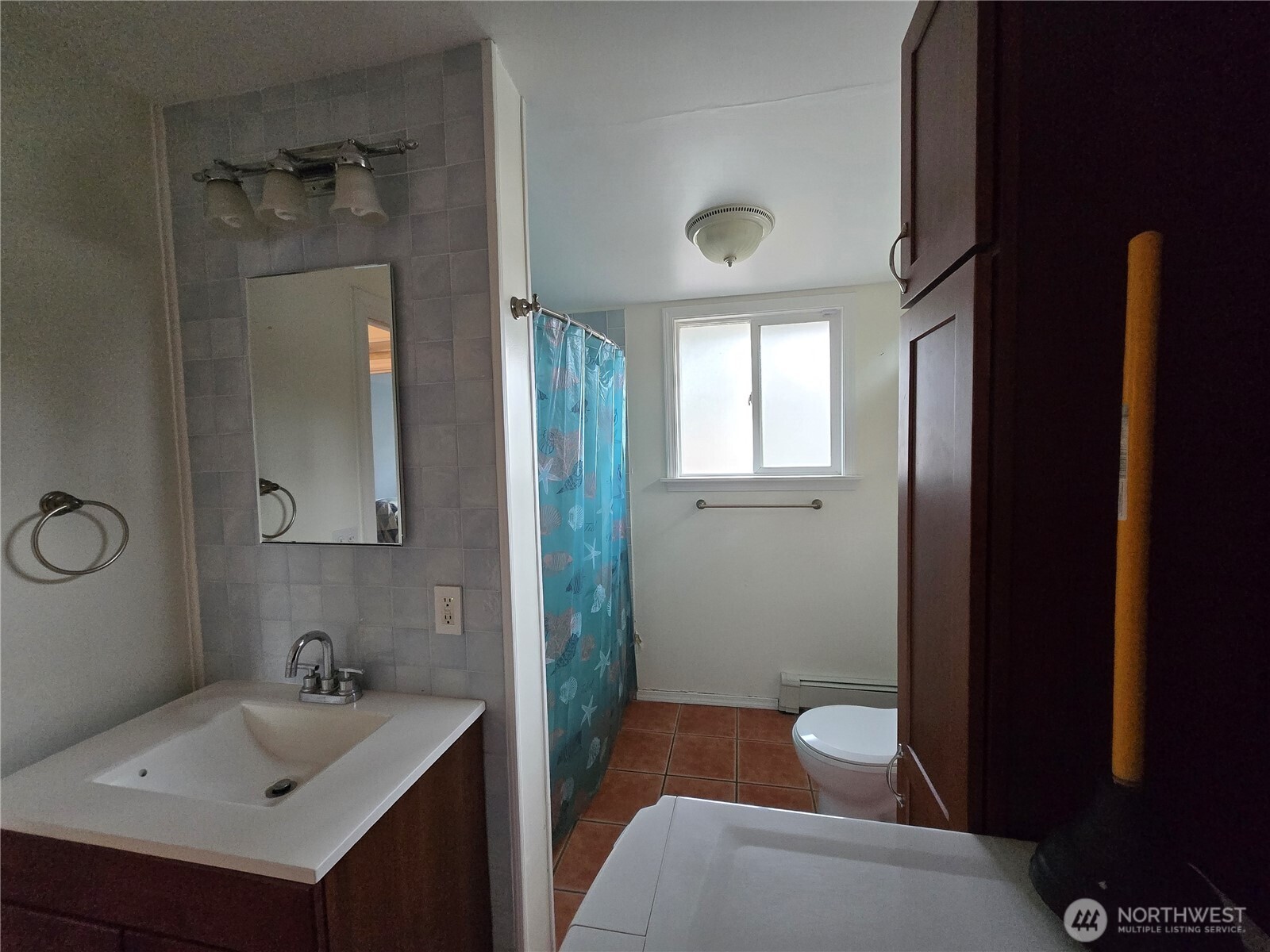 2205 300th Place Ocean Park, WA 98640 - Photo 18 of 20 a bathroom with a sink a toilet and shower