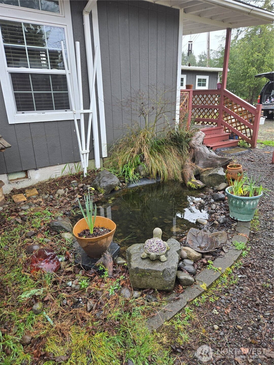 2205 300th Place Ocean Park, WA 98640 - Photo 4 of 20 a view of a porch with chairs and plants