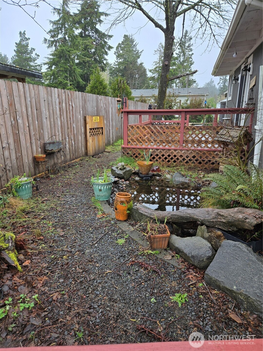 2205 300th Place Ocean Park, WA 98640 - Photo 7 of 20 a view of a backyard with wooden fence