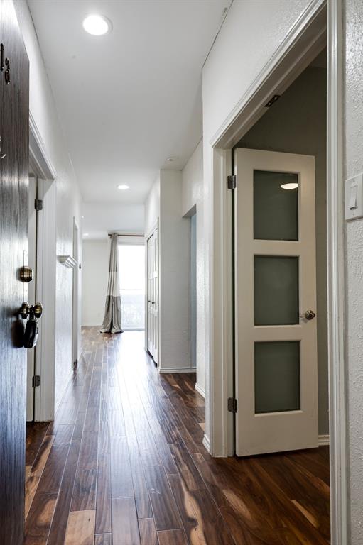 5310 Keller Springs Road, Unit 413 Dallas, TX 75248 - Photo 2 of 20 a view of a hallway with wooden floor and closet