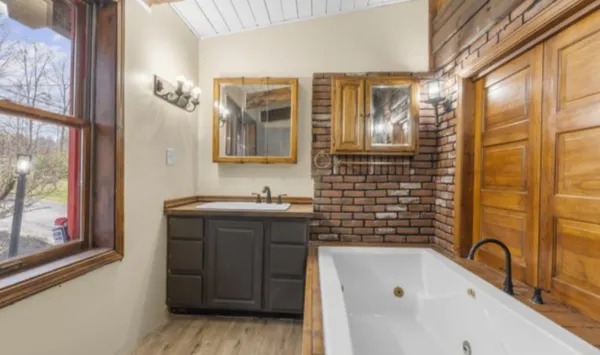 a bathroom with a sink and a mirror