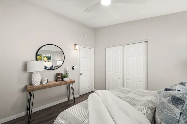 a bedroom with bed and a window