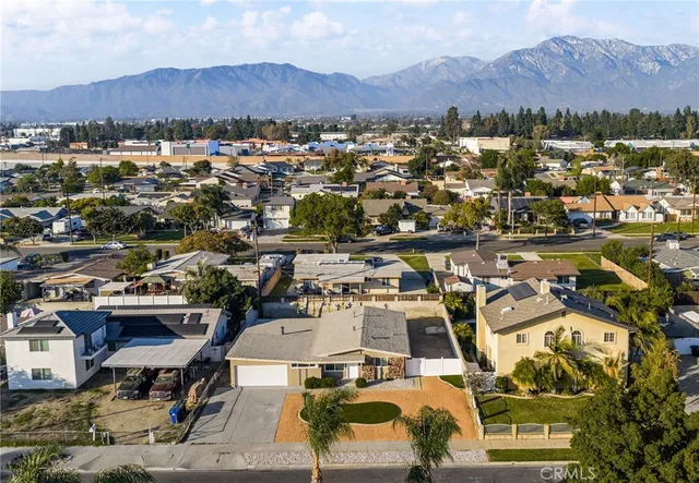 an aerial view of residential houses and outdoor space