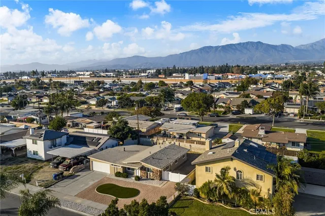 an aerial view of a house with a ocean view