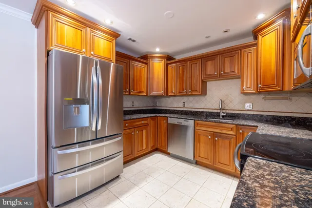 an aerial view of multiple house with outdoor space