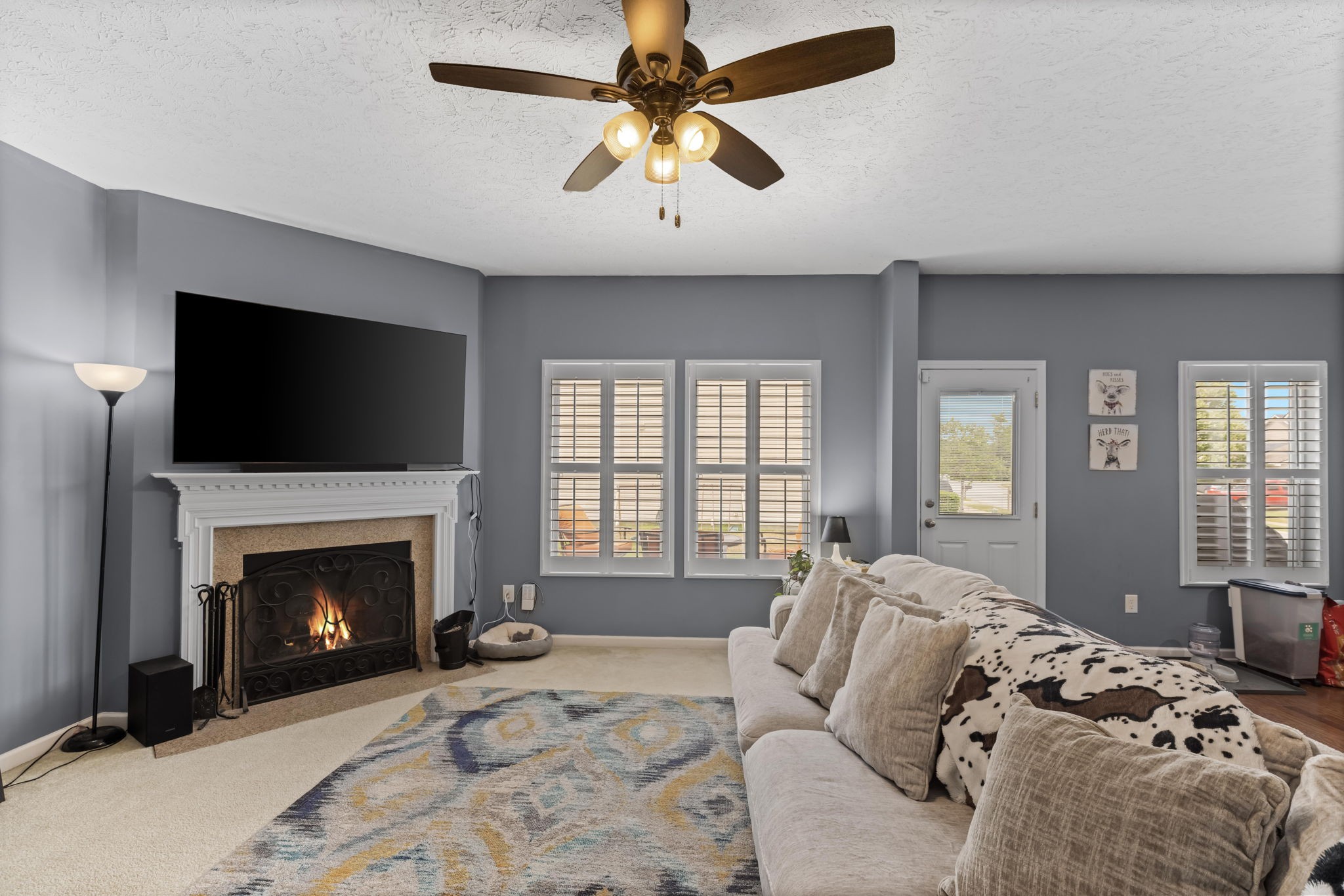 7 Shady Valley Drive Lebanon, TN 37087 - Photo 18 of 51 a bed room with a bed a fireplace and a chandelier