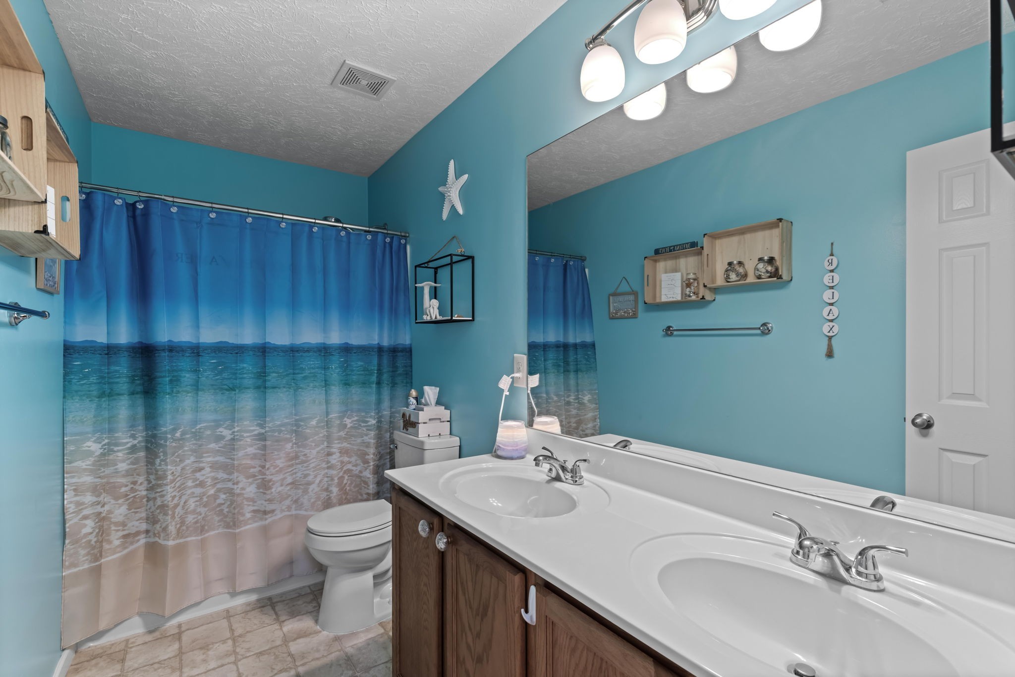 7 Shady Valley Drive Lebanon, TN 37087 - Photo 39 of 51 a bathroom with a sink a toilet and mirror