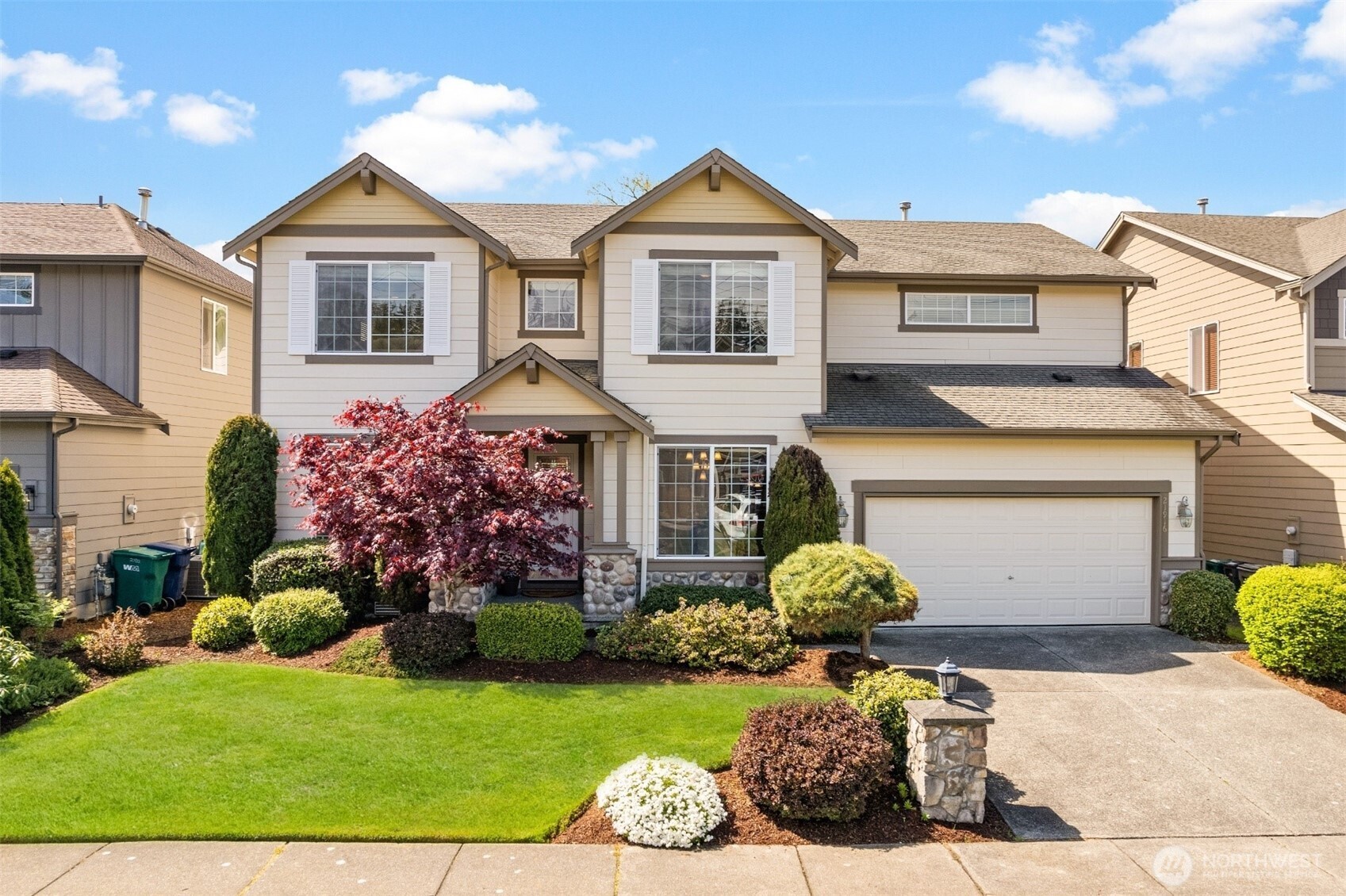 21916 42 Avenue Southeast Bothell, WA 98021 - Photo 1 of 1 a front view of a house with a yard and garage